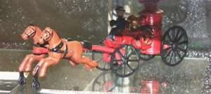 Steel horse and buggy toy Photo