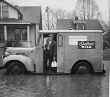 Milk Delivery On Flooded Street